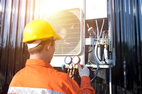 A Professional Air Conditioner Technician Checking The Refrigerant