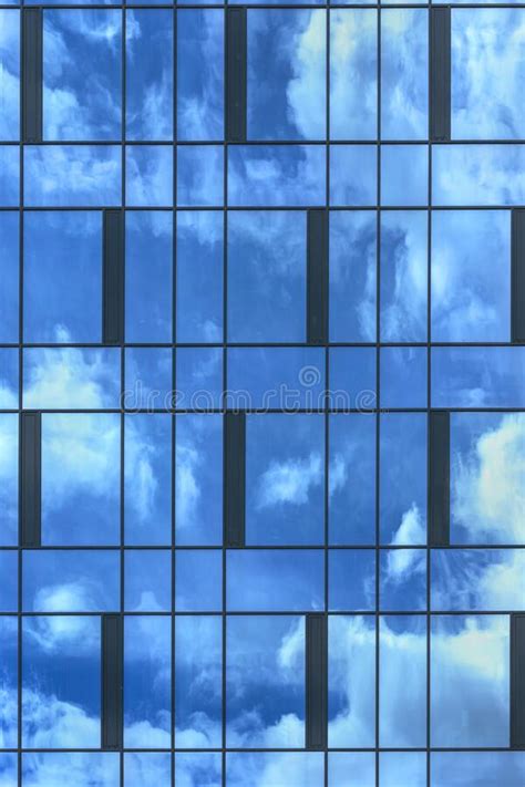 Blue Sky White Clouds Reflect In Highrise Building Windows Stock Photo