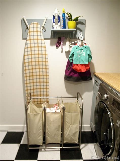 This project is super easy and takes about 15 minutes from start to finish! Laundry Room Ironing Board Wall Organizer - Reality Daydream