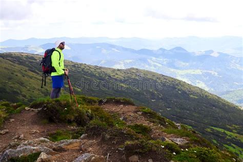Man Traveling With Backpack Hiking In Mountains Travel Lifestyle