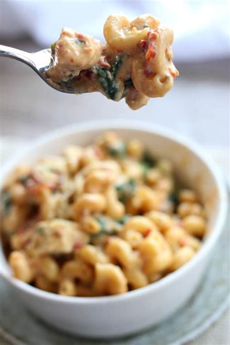 (you can remove oil if you don't like it, but it adds to the flavor.) stir. Instant Pot Tuscan Chicken Pasta--curly pasta is enveloped ...