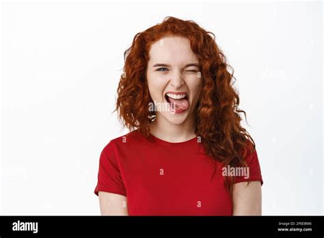 Portrait Of Carefree Young Teen Ginger Girl Making Positive Funny Faces