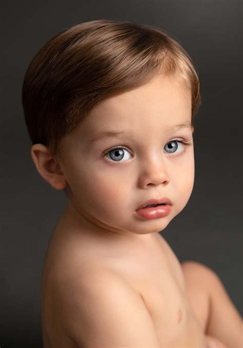 Cute Baby Boy With Blue Eyes And Brown Hair