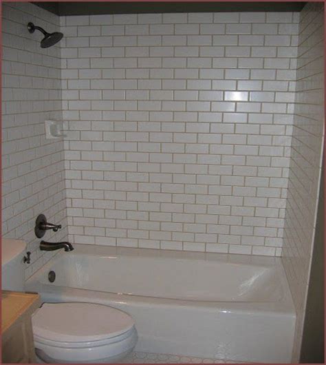 Ceramic tiles are a great way to go. White Tile Bathtub Surround Light Gray Grout. Jack & Jill ...