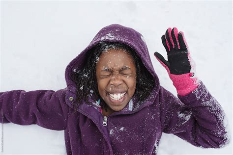 smiling black girl in snow by stocksy contributor gabi bucataru stocksy