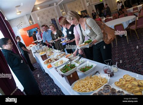 People Helping Themselves To Buffet Hi Res Stock Photography And Images