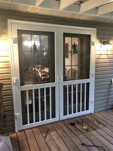 Or, if you have steel doors you can do like i did and purchase magnetic curtain rods. Two screen doors for our French doors. Do it yourself ...
