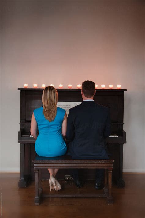 Romantic Couple Playing Piano Together By Candle Light By Andersen Ross