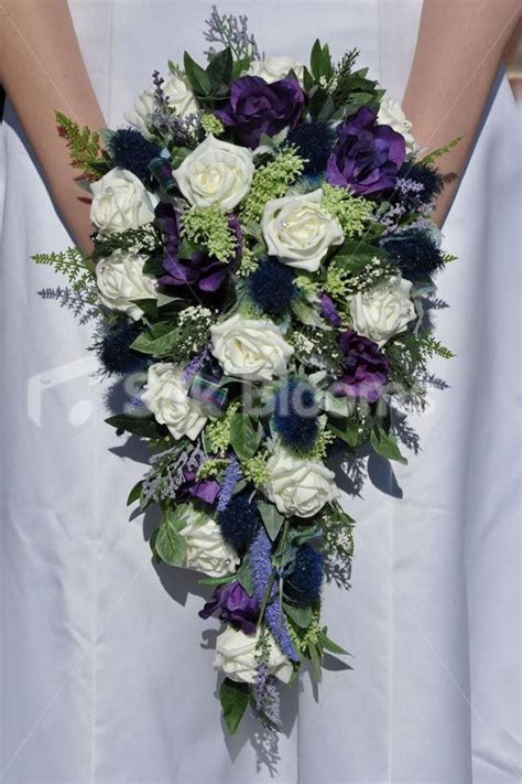 scottish inspired ivory rose thistle and lisianthus cascade bridal bouquet lily bouquet wedding