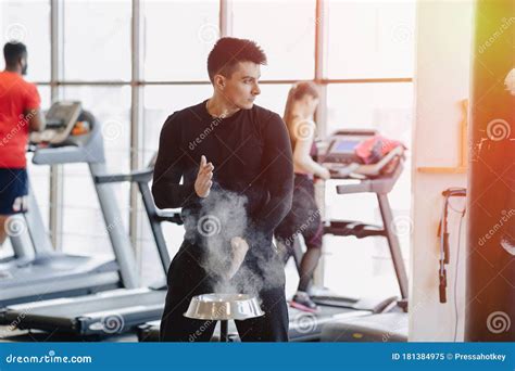 Stylish Guy In The Gym Rubs His Hands With A Talc Cloud Of Dust From Hands Stock Image Image