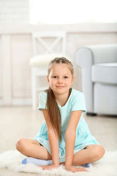 Little Girl Sitting On Rooms Floor Stock Photo By ©tan4ikk 405597268