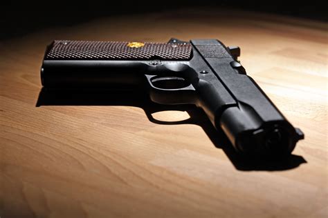 M1911 Pistol On The Wooden Table Shallow Dof Espositos Custom Guns