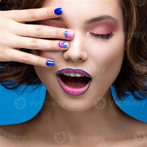 Beautiful Model Girl With Bright Makeup And Colored Nail Polish