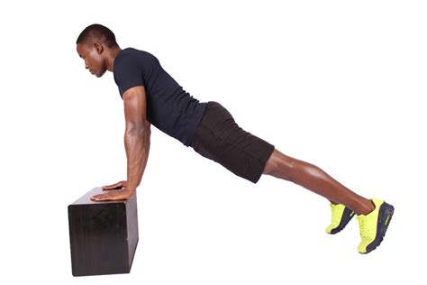 Fitness Man Doing Incline Push Ups On Step Up Box