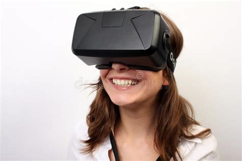 an impressed surprised flabbergasted woman taking off or putting on oculus rift vr virtual