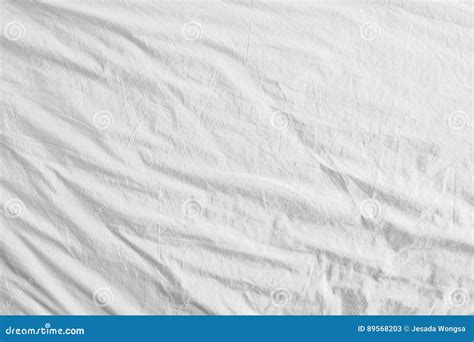 Top View Of Bedding Sheets Or White Fabric Wrinkle Texture Background