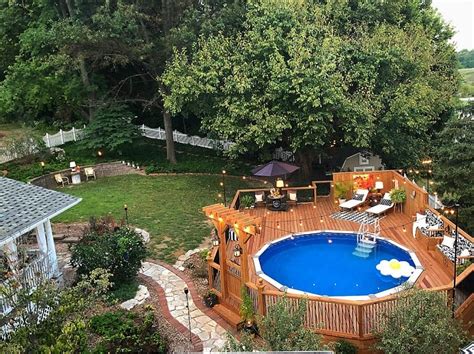 This is a larger deck that will go halfway around your pool. The Top 47 Best Above Ground Pool Deck Ideas - Backyard ...