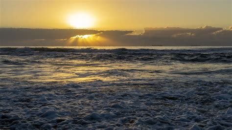 Ocean Waves In Black Yellow Clouds Sky Background During Sunset 4k Hd