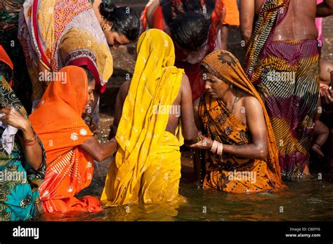 indian hindu pilgrims bathing in the ganges river at dashashwamedh ghat in holy city of varanasi
