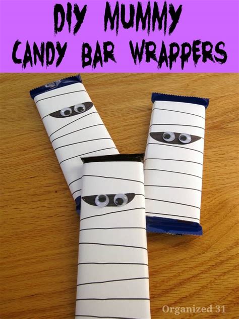 Trick or treat time is approaching so why not get the kids to make this adorable duo to wrap their halloween chocolates in? DIY Mummy Candy Bar Wrapper - Organized 31