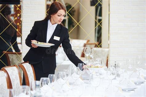 Restaurant Waitress Serving Table With Food Stock Image Image Of