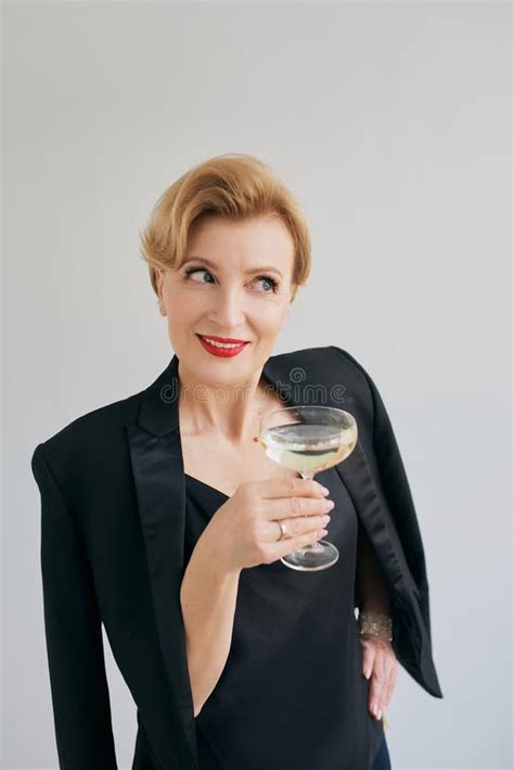 Mature Stylish Elegant Woman In Tuxedo With Glass Of Sparkling Wine Stock Image Image Of
