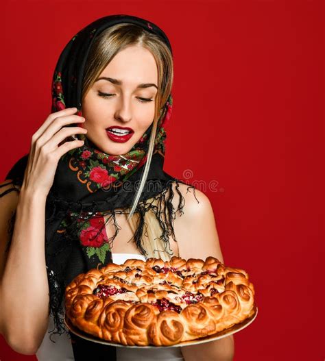 Portrait Of A Young Beautiful Blonde In Headscarf Holding A Delicious Homemade Cherry Pie Stock