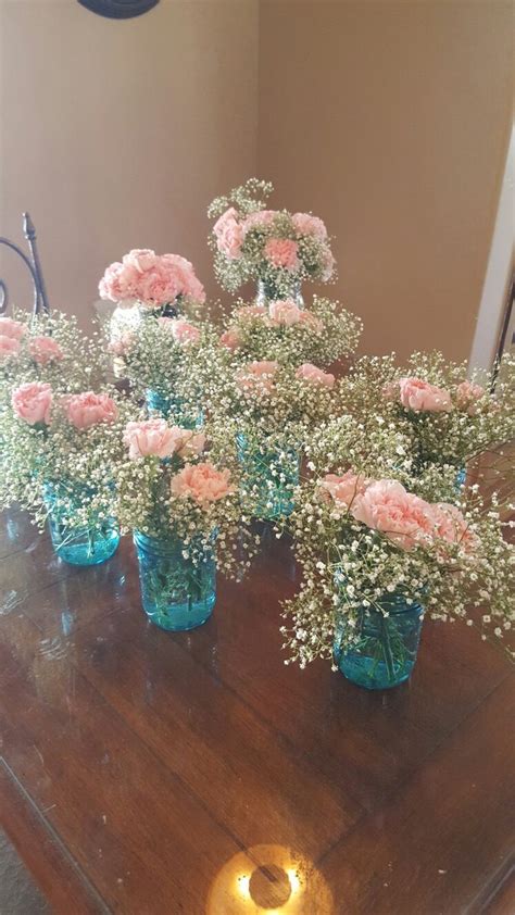 Blue Mason Jars With Pink Carnations And Babys Breath For Gender Reveal