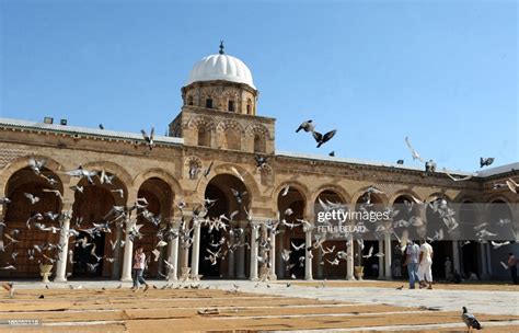 People Walk In The Zitouna Mosque Also Called The Mosque Of The