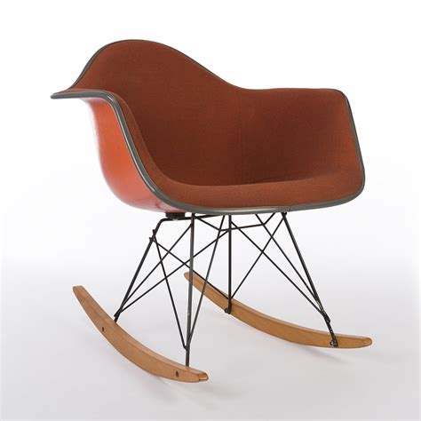 Current production models eames aluminum group side chair Original Herman Miller Orange Upholstered Eames RAR Arm ...
