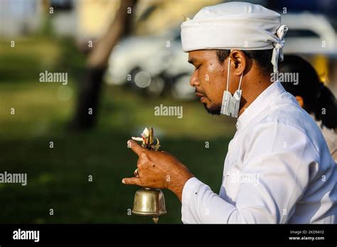 A Balinese Hindu Man Prays During The Melasti A Purification Ceremony Ahead Of Nyepi At A Beach