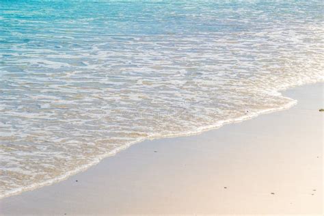 Soft Wave Of Blue Ocean On Wet Sandy Beach Background Stock Photo