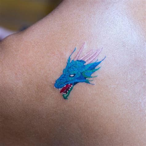 Blue Dragon Head Tattoo On The Left Shoulder Blade Shoulder Tattoo