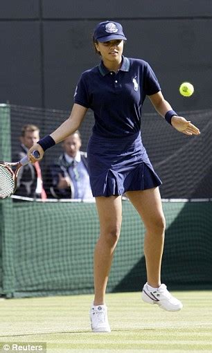 smash and volley one ballgirl provides landing mat for 6ft 3in tennis star while another enjoys