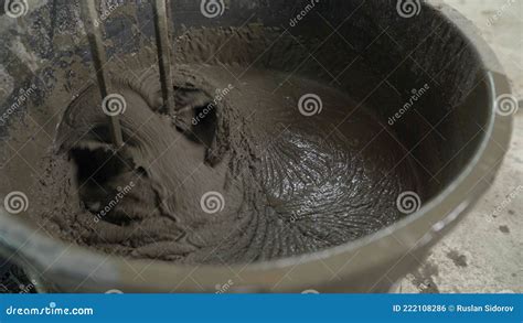 Mixing Concrete Plaster With Electric Mixer Stir The Solution In The Bucket With A Mixer Stir