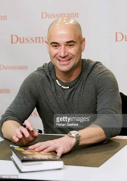 Andre Agassi Signs His New Book Open Photos And Premium High Res