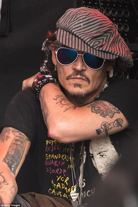 Johnny Depp Spotted At The Pyramid Stage Watching Corbyn