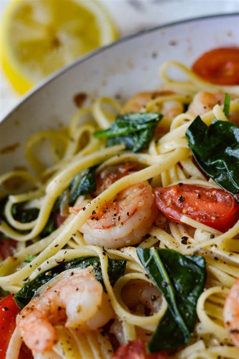 shrimp scampi pasta with spinach and cherry tomatoes linger