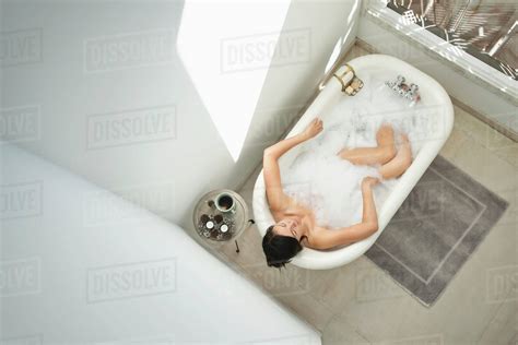 Woman Having Bubble Bath In Bathroom Stock Photo Dissolve