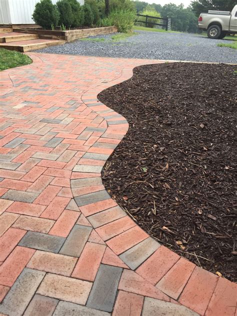 Use a level to make sure each brick is lying flat. Brick Walkway - Landscape Edging, Lawn Edging & Paver Edging