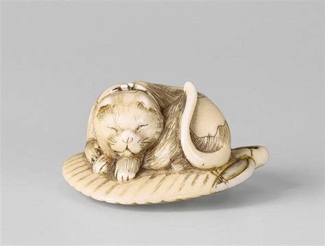 Vintage netsuke hand carved stone turtle netsuke bead 1 7/8l x 1 3/8w x 1/2t. An ivory netsuke of a sleeping spotted cat. Early 19th centu
