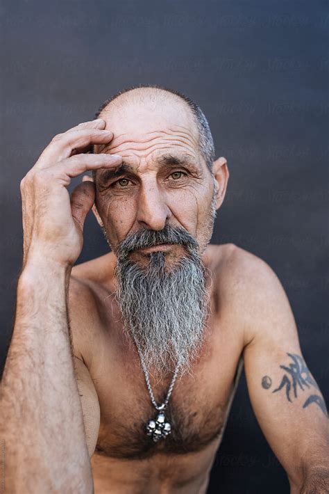 Portrait Of A Tattooed Aged Man By Stocksy Contributor Javier