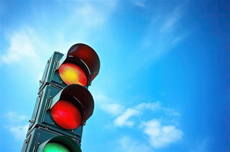 Premium Ai Image Traffic Lights In Red And Green Against A Backdrop