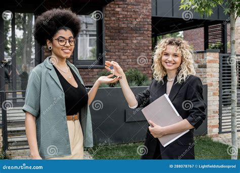 Blonde Real Estate Agent Giving Key Stock Image Image Of Architecture