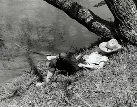 1940s Barefoot Boy Sleeping Under Tree Photograph By Vintage Images