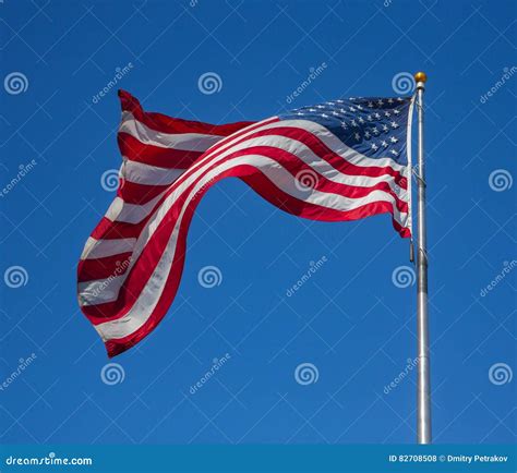 Proud Flag Of United States Of America Waving On The Wind Stock Photo