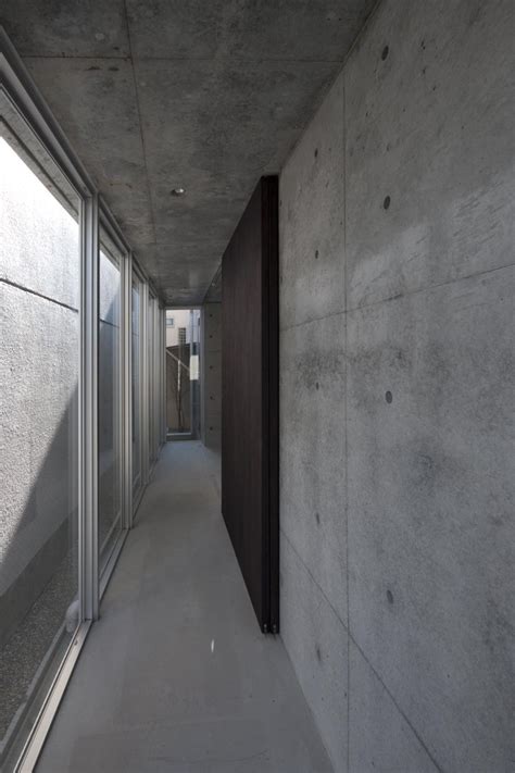 A Minimalist House With A Sleek Concrete Structure Minimalist House