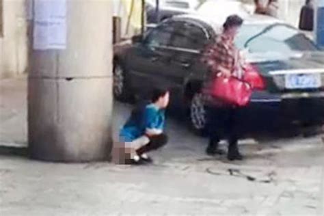 Sickening Video Shows Woman Pooing In Street Outside Train Station As