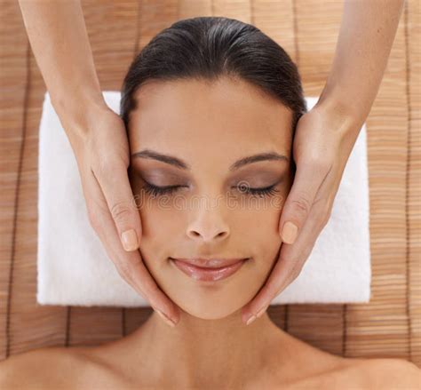 Whole Body Care A Young Woman Enjoying A Head And Face Massage At A