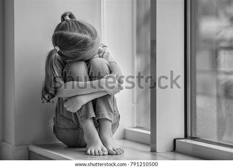 Sad Little Girl Sitting On Windowsill Stock Photo 791210500 Shutterstock